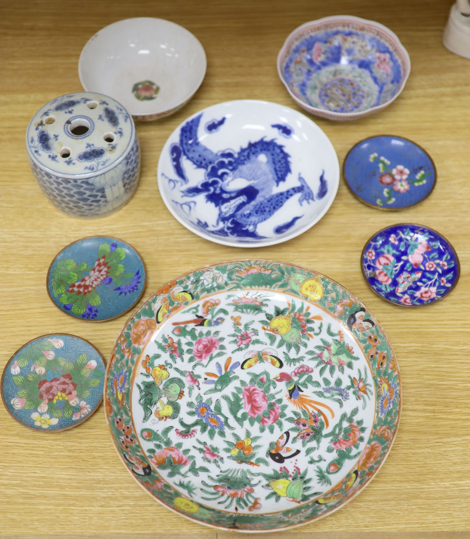 A quantity of Chinese and Japanese ceramics, including a blue and white dragon dish, a Cantonese famille rose dish, four cloisonne pi